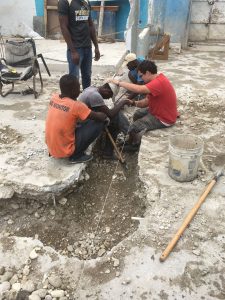 Prayer at a work site in Haiti - Missions